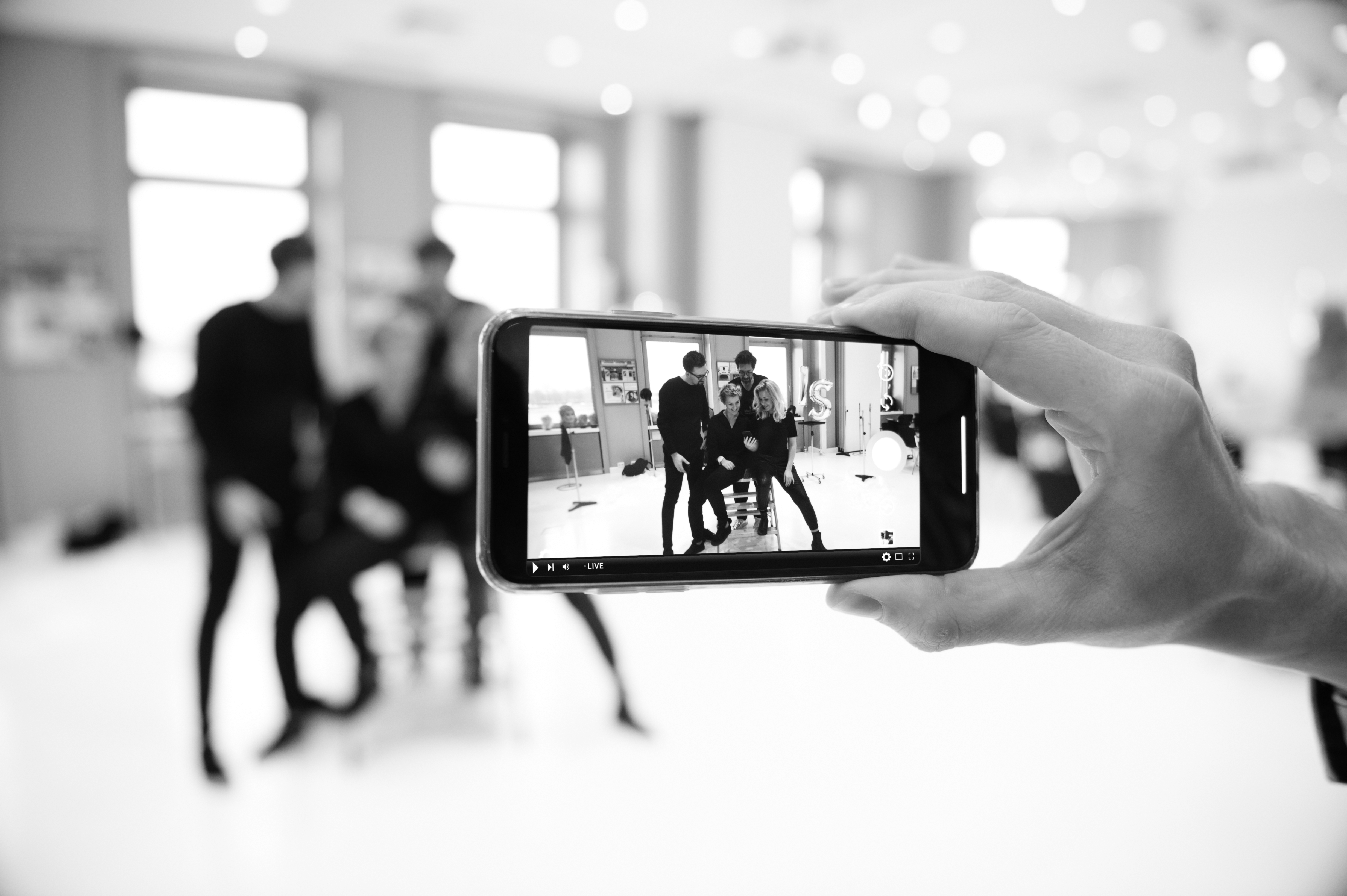 Mobile phone taking picture of people